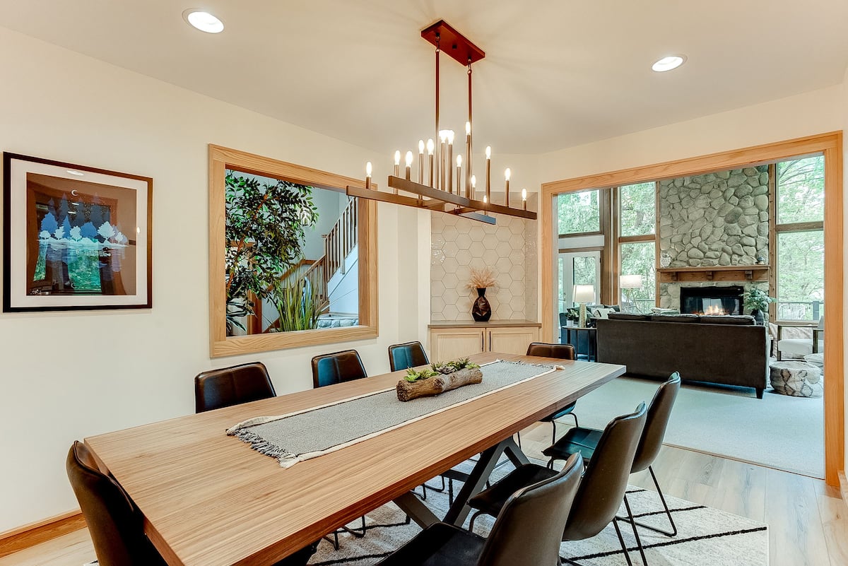 Formal dining room with long table and chandelier