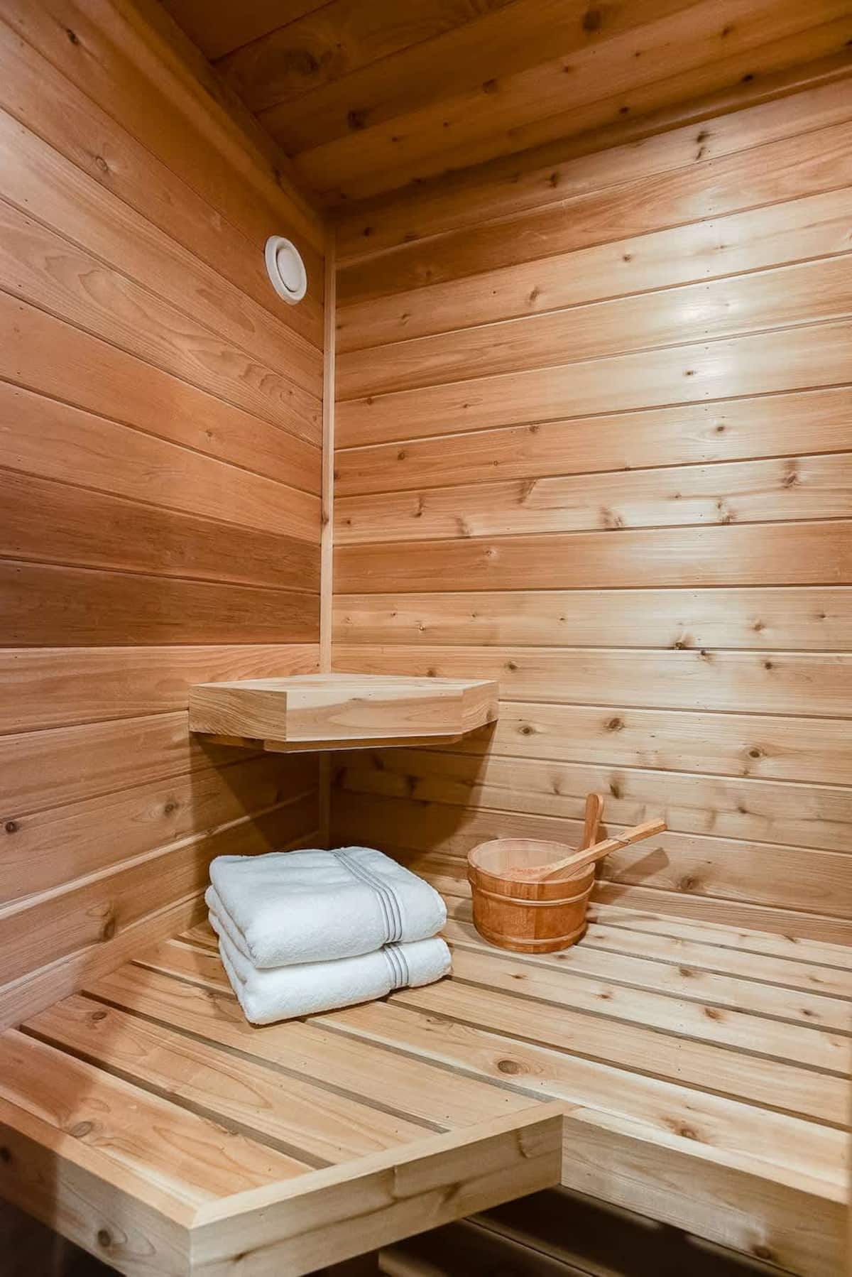 Upper loft walkway with vaulted wood ceilings and warm lighting